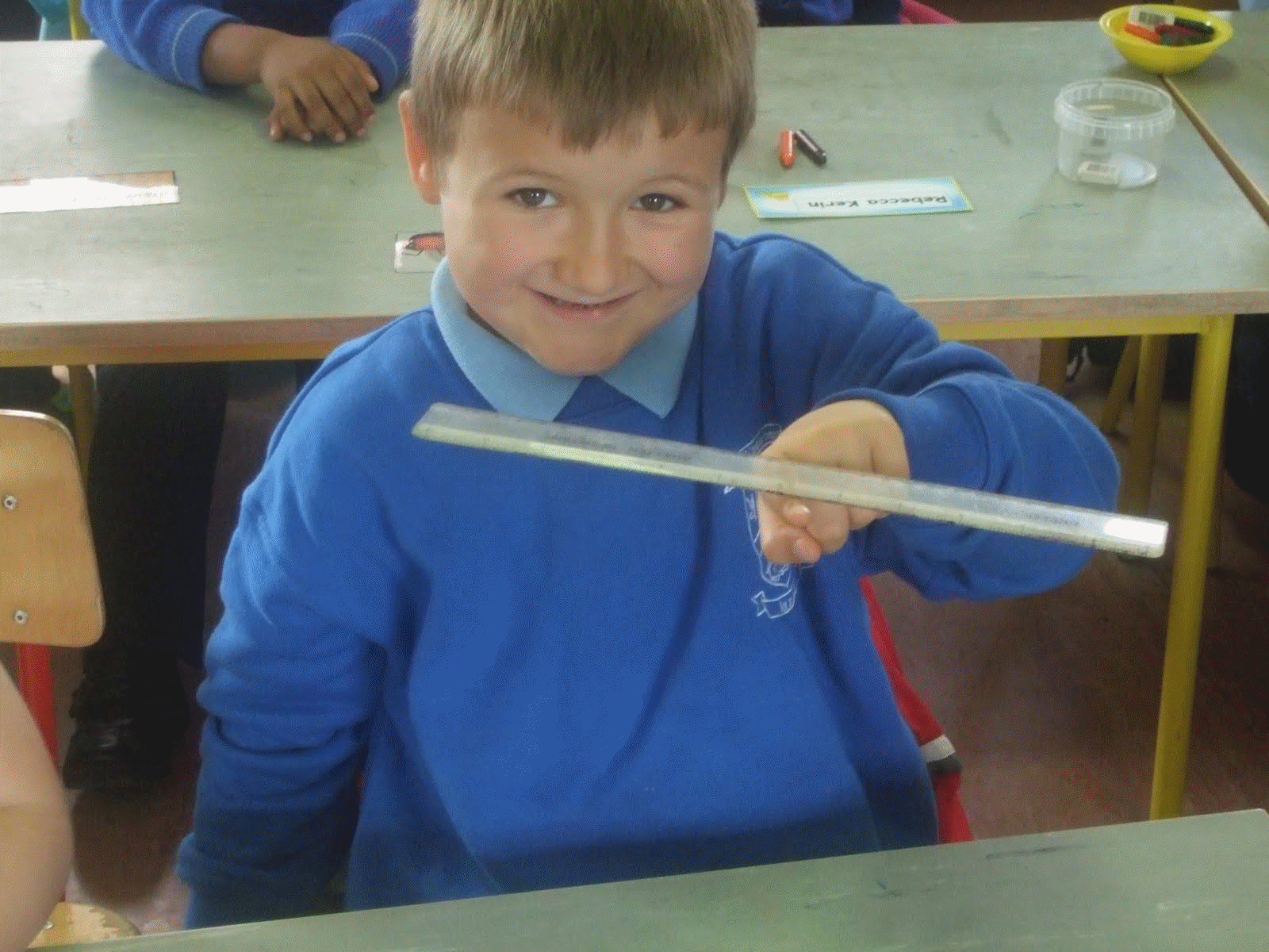 Center of Gravity of a ruler stays at the middle of it: